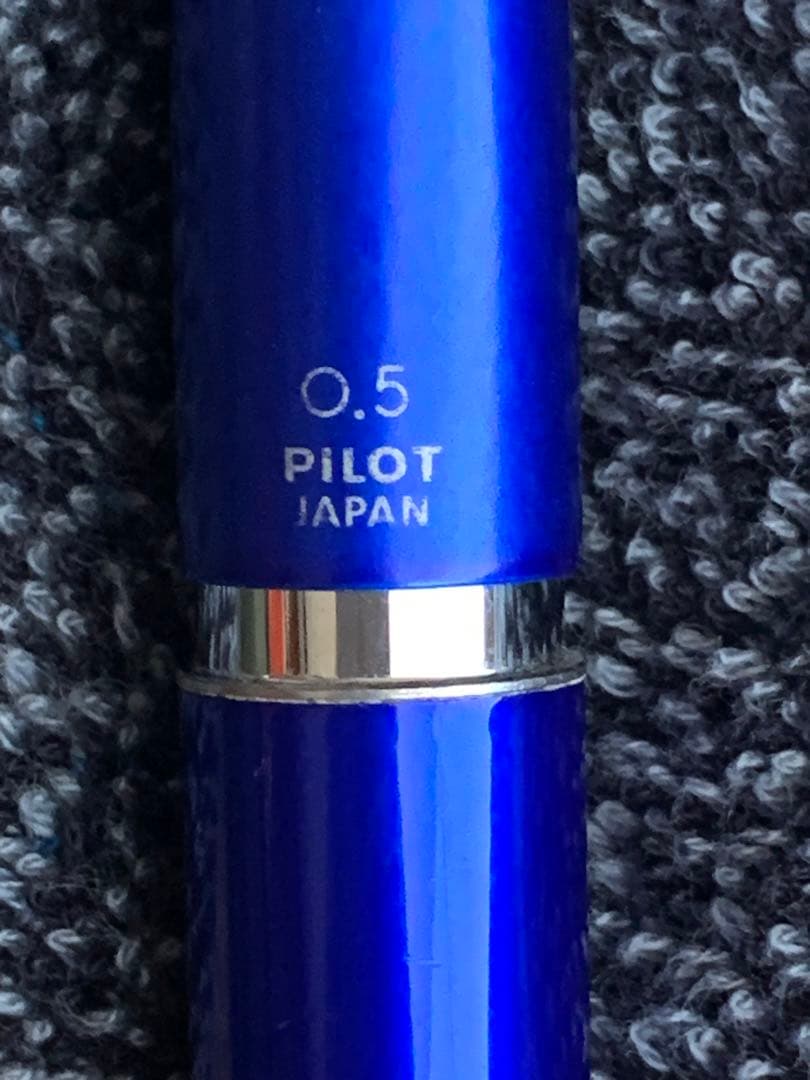 Pilot mechanical pencil in vibrant royal blue with click mechanism and minor paint chip on grip area