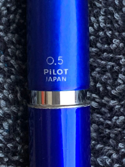 Pilot mechanical pencil in vibrant royal blue with click mechanism and minor paint chip on grip area