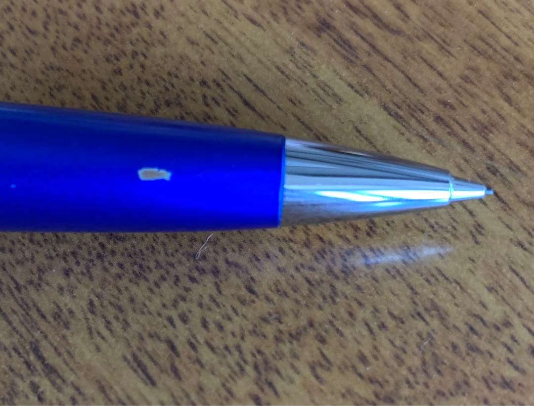 Pilot mechanical pencil in vibrant royal blue with click mechanism and minor paint chip on grip area