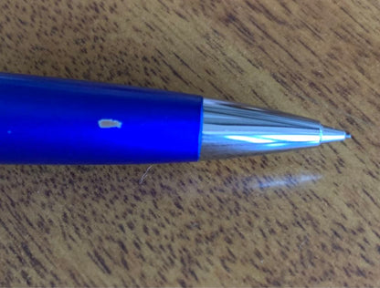 Pilot mechanical pencil in vibrant royal blue with click mechanism and minor paint chip on grip area
