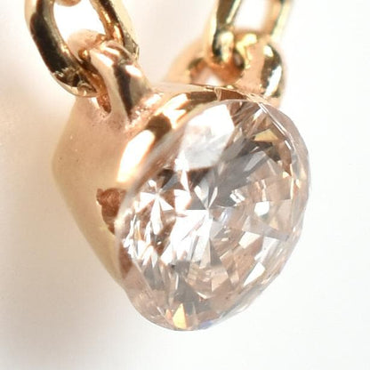 agete Law yellow gold necklace featuring one pearl and a small diamond, 40 cm length with 3 cm adjuster