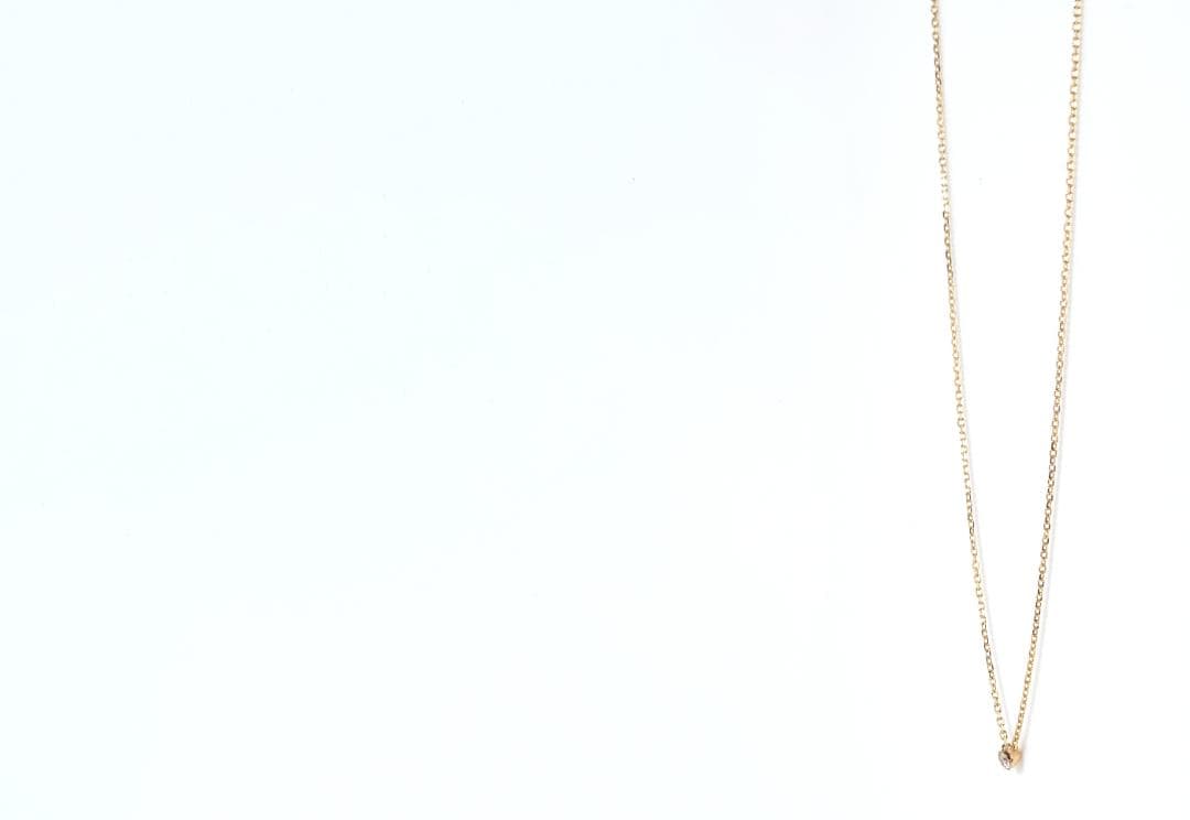 agete Law yellow gold necklace featuring one pearl and a small diamond, 40 cm length with 3 cm adjuster