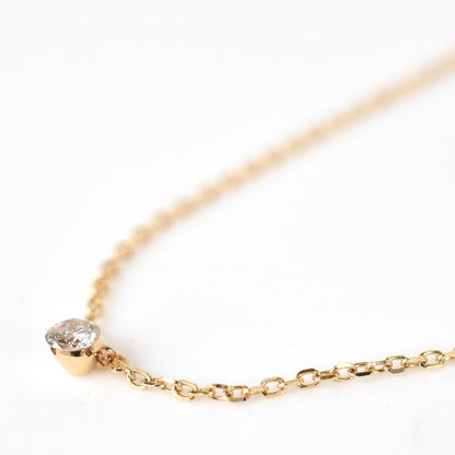 agete Law yellow gold necklace featuring one pearl and a small diamond, 40 cm length with 3 cm adjuster