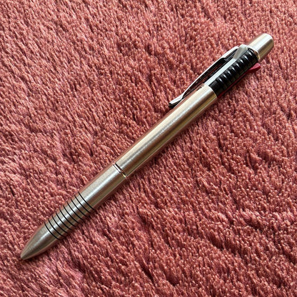 Pilot 2+1 Midy multi-function pen with stainless steel body showing rotating mechanism