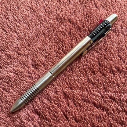Pilot 2+1 Midy multi-function pen with stainless steel body showing rotating mechanism