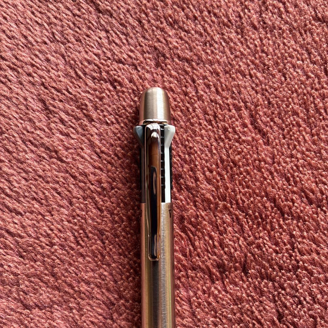 Pilot 2+1 Midy multi-function pen with stainless steel body showing rotating mechanism