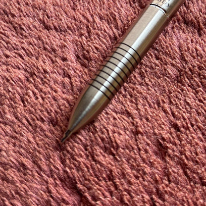 Pilot 2+1 Midy multi-function pen with stainless steel body showing rotating mechanism