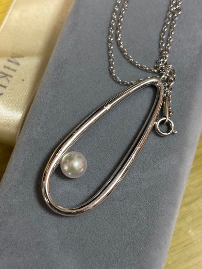 MIKIMOTO Moon Dew pearl necklace showing main body and ribbon with visible scratches