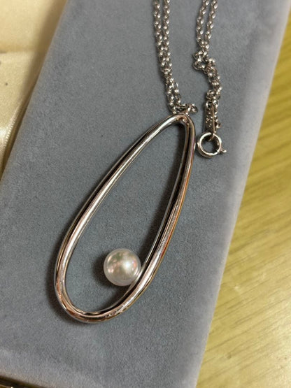 MIKIMOTO Moon Dew pearl necklace showing main body and ribbon with visible scratches