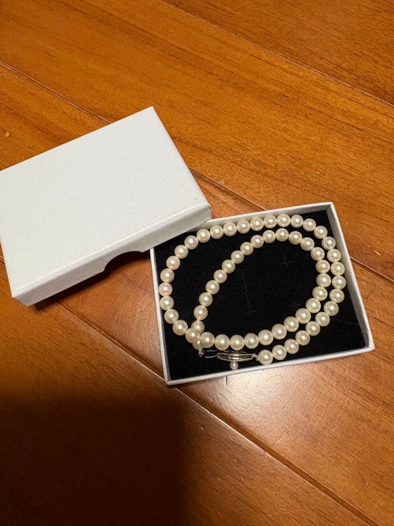 Mikimoto white pearl necklace with 58 round pearls sized 6.0-6.4mm in a single strand