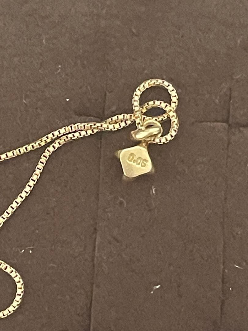 Agato K18 single diamond necklace weighing approximately 1.7 to 1.8 grams displayed on a white background
