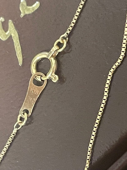 Agato K18 single diamond necklace weighing approximately 1.7 to 1.8 grams displayed on a white background