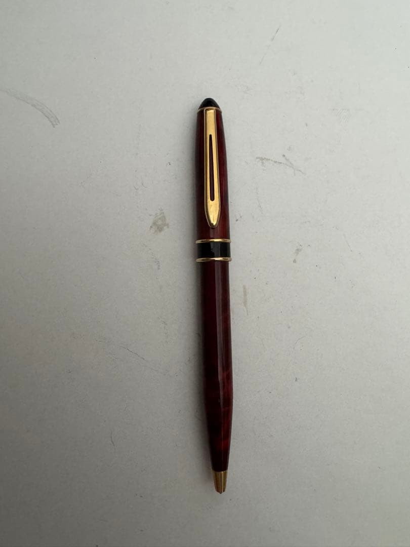 Waterman Marble Pattern ballpoint pen in red marble with gold trim and twist mechanism