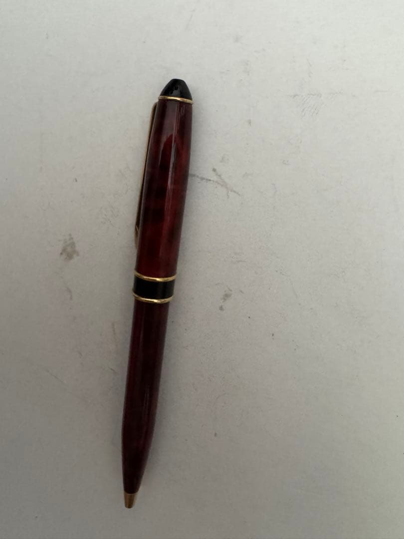 Waterman Marble Pattern ballpoint pen in red marble with gold trim and twist mechanism