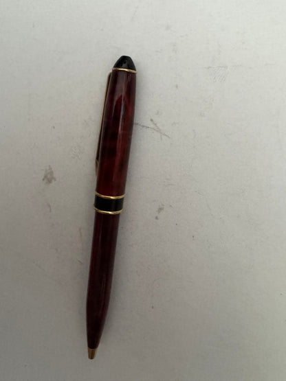 Waterman Marble Pattern ballpoint pen in red marble with gold trim and twist mechanism