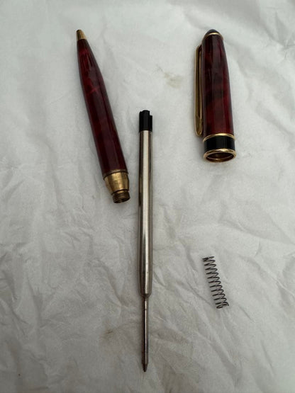 Waterman Marble Pattern ballpoint pen in red marble with gold trim and twist mechanism