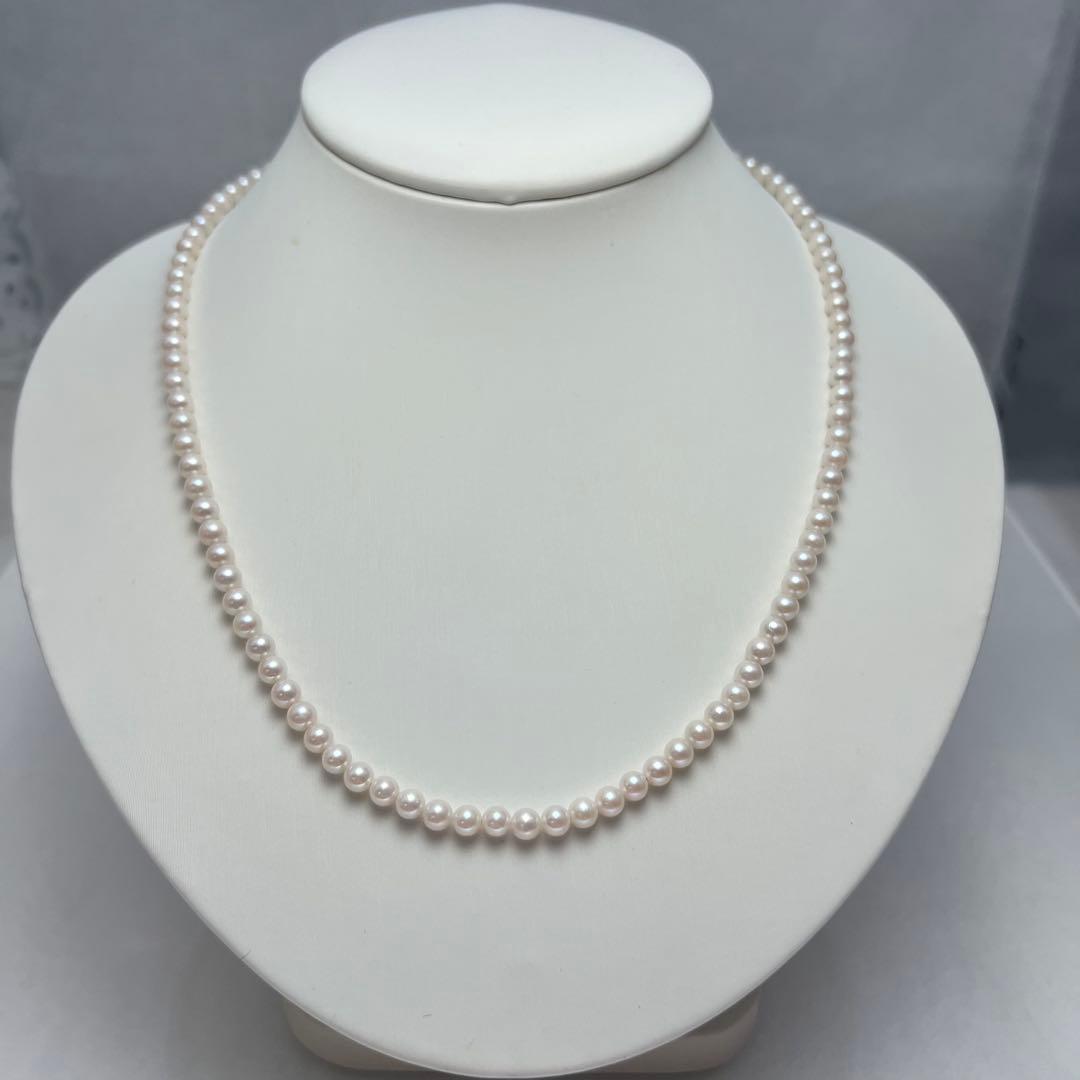 Close-up of Akoya pearl necklace featuring 4-4.5mm lustrous white pearls on a delicate strand