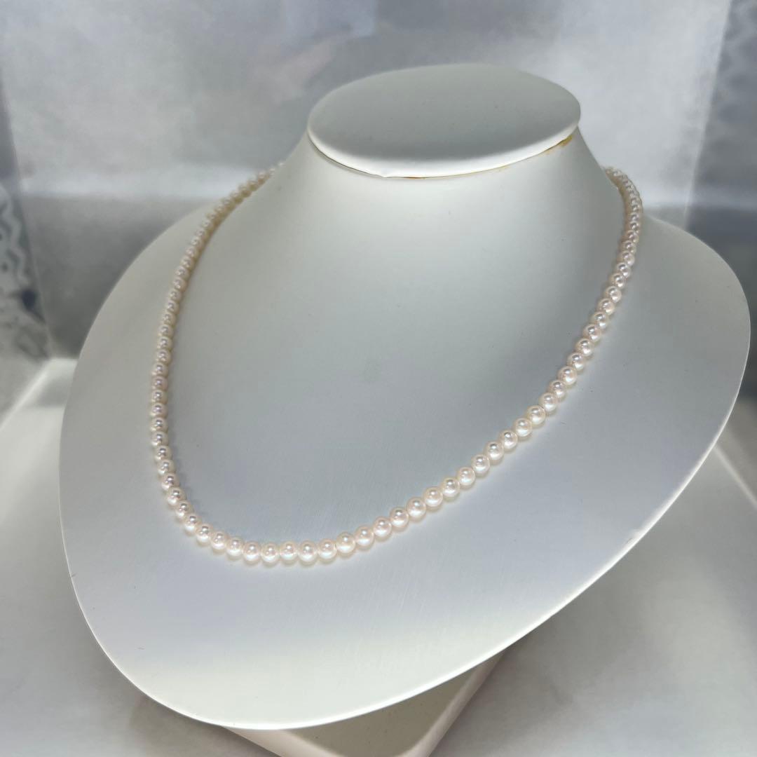 Close-up of Akoya pearl necklace featuring 4-4.5mm lustrous white pearls on a delicate strand