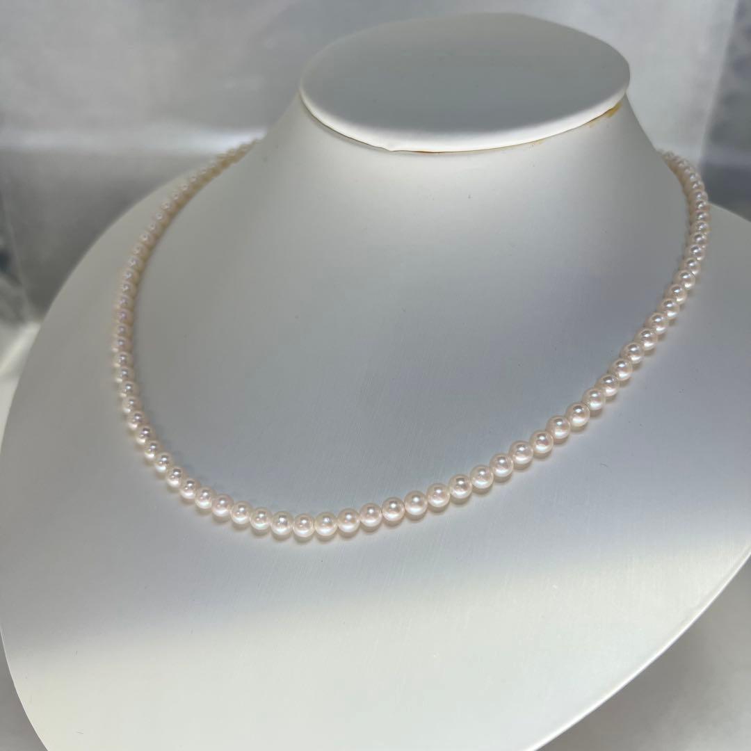 Close-up of Akoya pearl necklace featuring 4-4.5mm lustrous white pearls on a delicate strand