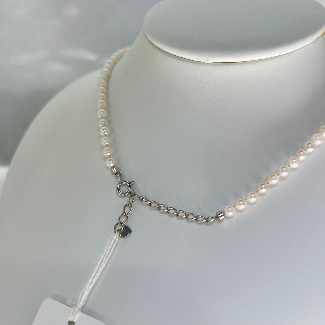 Close-up of Akoya pearl necklace featuring 4-4.5mm lustrous white pearls on a delicate strand