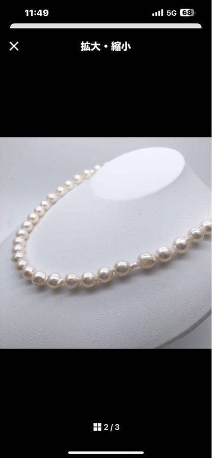 Akoya pearl necklace with 9-9.5mm baroque white pearls having a slight pink tint, 40.5 cm long