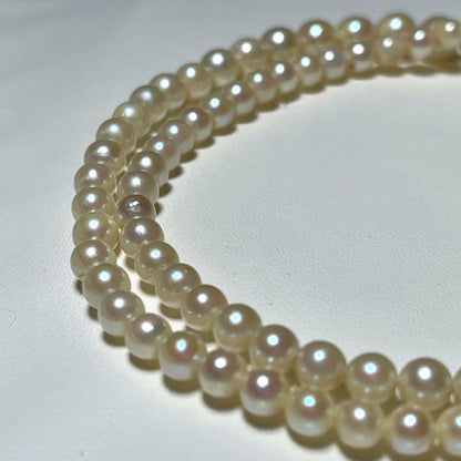Akoya pearl necklace with round white pearls 3.3-7.4mm and silver stamp on a 45cm chain