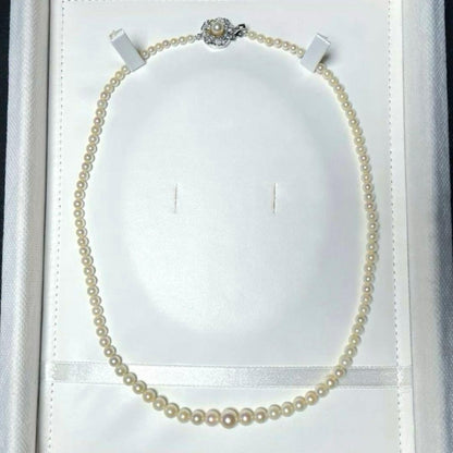 Akoya pearl necklace with round white pearls 3.3-7.4mm and silver stamp on a 45cm chain