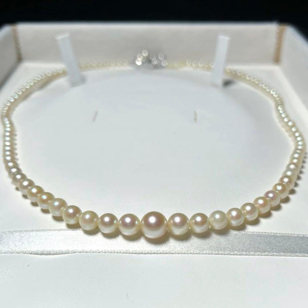 Akoya pearl necklace with round white pearls 3.3-7.4mm and silver stamp on a 45cm chain