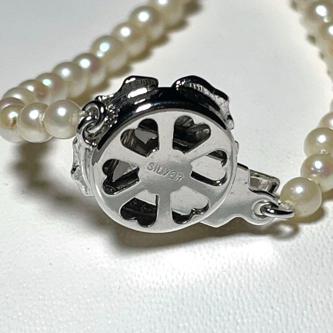 Akoya pearl necklace with round white pearls 3.3-7.4mm and silver stamp on a 45cm chain
