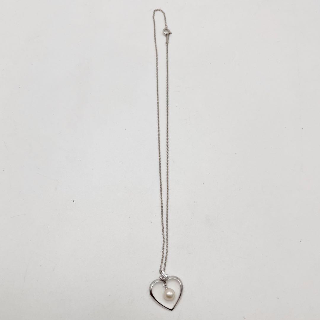 Mikimoto necklace with one genuine white pearl on a silver chain with engraved silver clasp