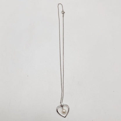 Mikimoto necklace with one genuine white pearl on a silver chain with engraved silver clasp