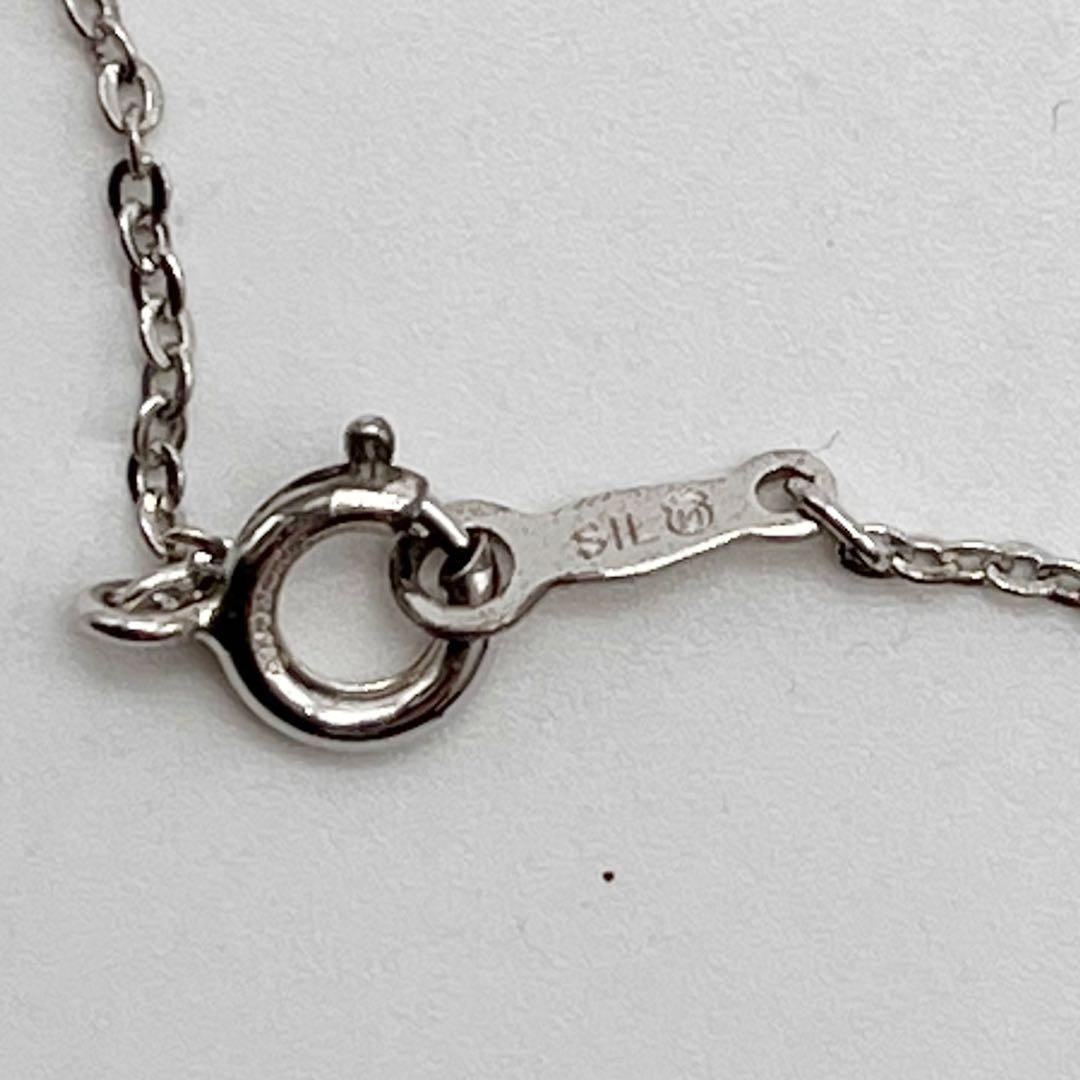 Mikimoto necklace with one genuine white pearl on a silver chain with engraved silver clasp