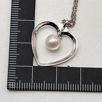Mikimoto necklace with one genuine white pearl on a silver chain with engraved silver clasp