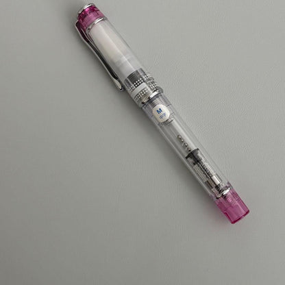 PILOT PRERA fountain pen clear pink body with medium nib tip shown uncapped