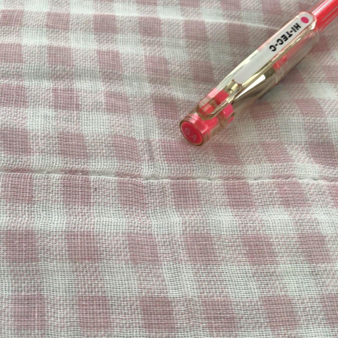 Pilot Hi-Tec C ballpoint pen in fluorescent pink with ink visible, discontinued edition