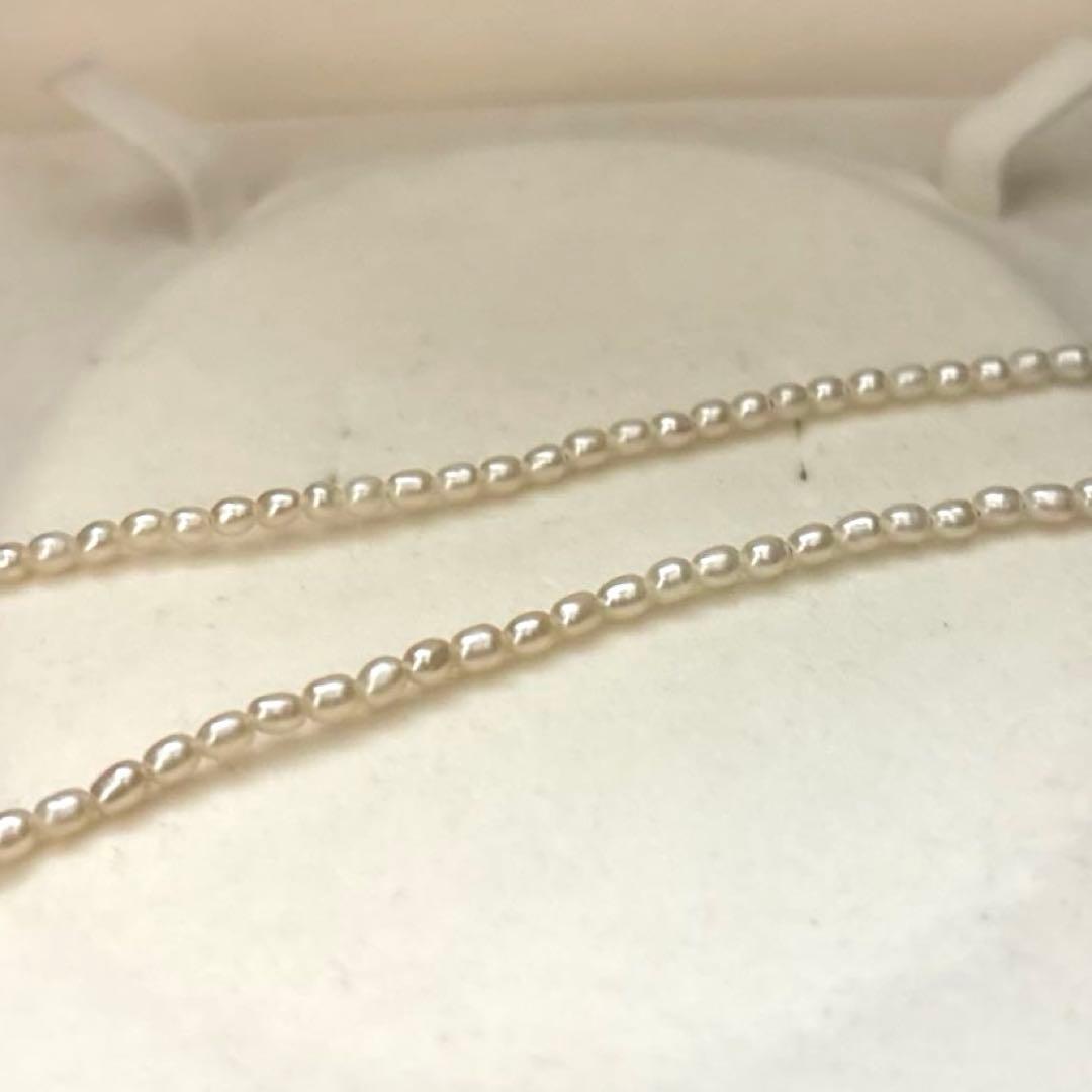 K18 gold necklace with natural white Akoya baby pearls sized 2.5-3mm on a 39cm chain