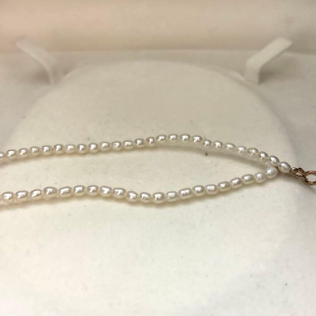 K18 gold necklace with natural white Akoya baby pearls sized 2.5-3mm on a 39cm chain