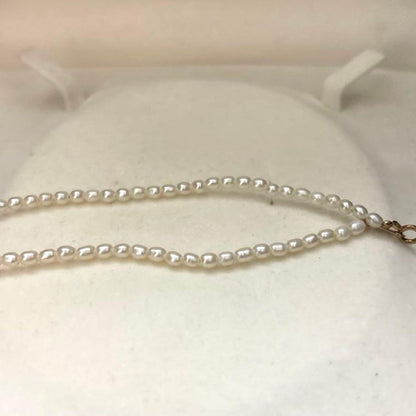 K18 gold necklace with natural white Akoya baby pearls sized 2.5-3mm on a 39cm chain