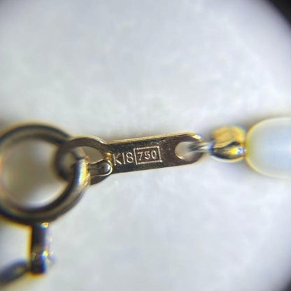 K18 gold necklace with natural white Akoya baby pearls sized 2.5-3mm on a 39cm chain
