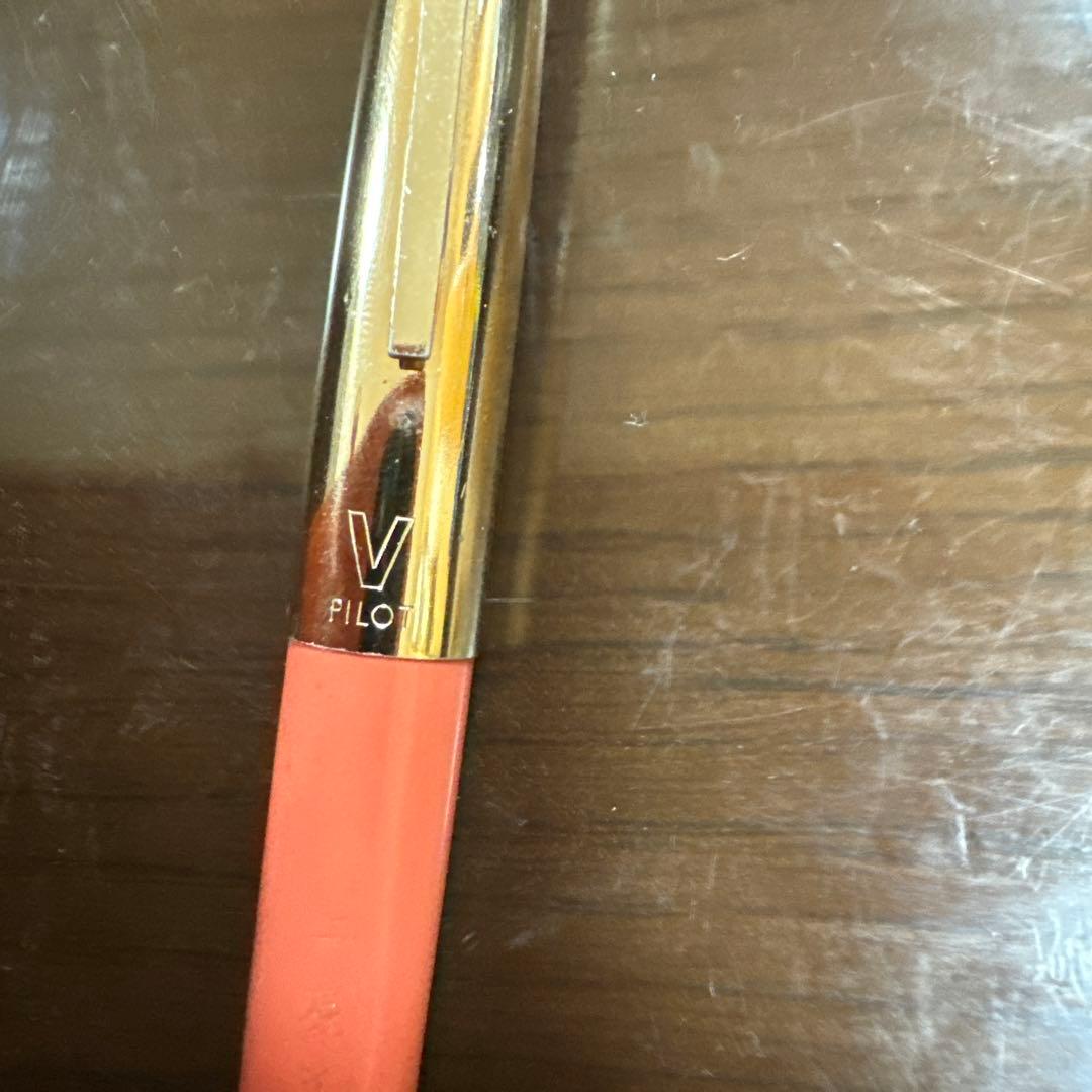 PILOT V Series fountain pen in coral pink color with Japanese engraved markings on the body