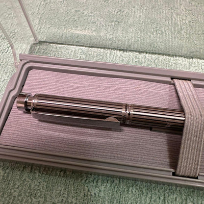 Silver Pilot Switch key-engraved pen with fine tip and stripe design beside its case