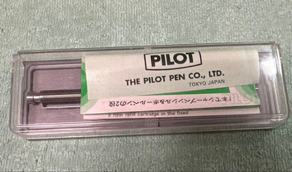 Silver Pilot Switch key-engraved pen with fine tip and stripe design beside its case