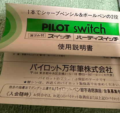 Silver Pilot Switch key-engraved pen with fine tip and stripe design beside its case