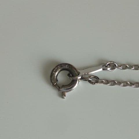 MIKIMOTO Necklace with 45 centimeter chain featuring elegant pearls on a white background