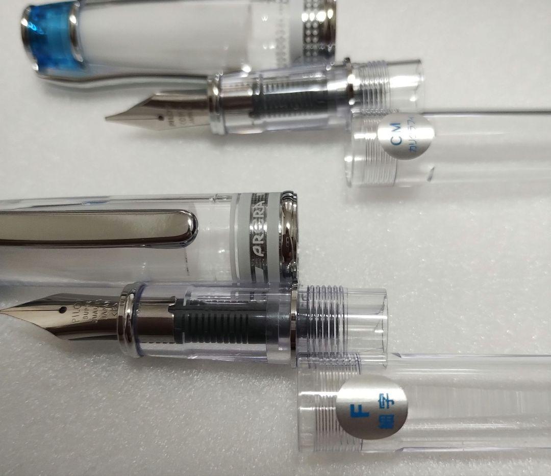 Pilot Prera fountain pen with transparent blue body and fine F nib alongside calligraphy CM nib