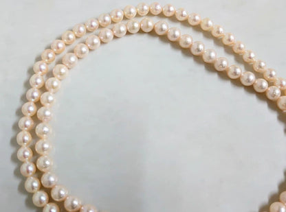 Akoya pearl long necklace with 7-8 mm pinkish white pearls on silver chain, length 81 cm