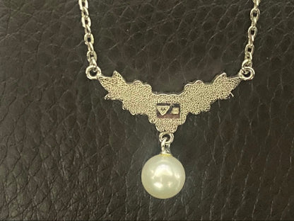 Mikimoto genuine pearl necklace with 40cm sterling silver chain on white background