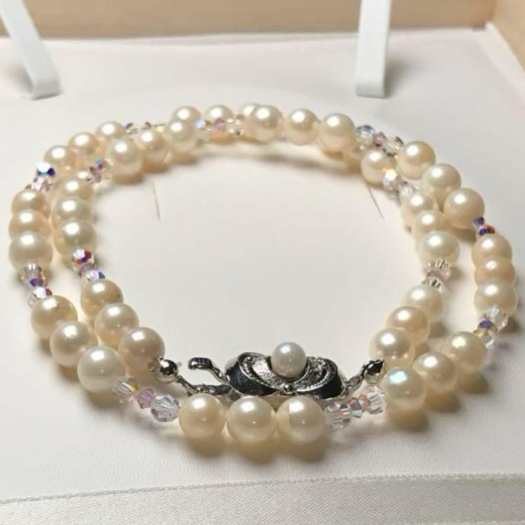 Akoya pearl and crystal necklace measuring 46.5cm with 6.6-6.9mm pearls, styled for dining events