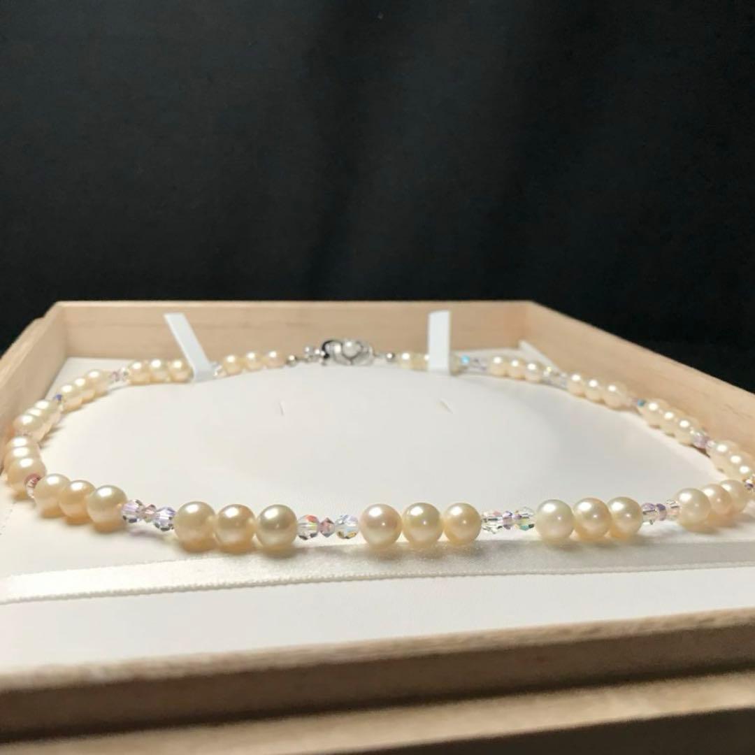 Akoya pearl and crystal necklace measuring 46.5cm with 6.6-6.9mm pearls, styled for dining events
