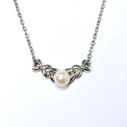 Mikimoto pearl necklace with 5.3mm pearls and silver leaf pendant on 40cm chain